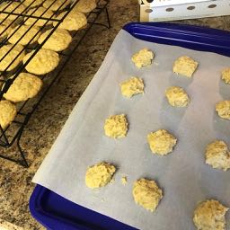 Cookies cooling and cookies ready to go in the oven